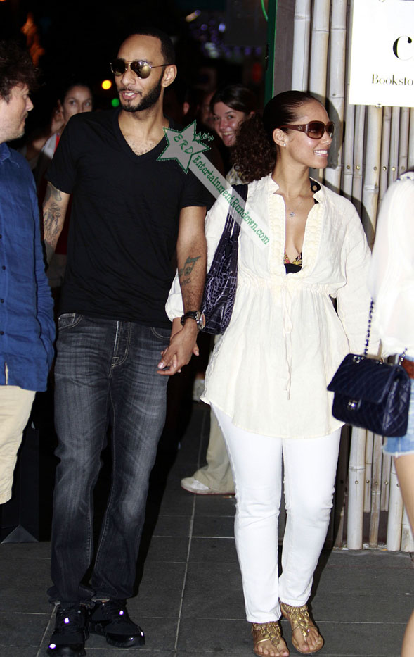 Singer Alicia Keys and her husband Swizz Beatz come down from their villa to