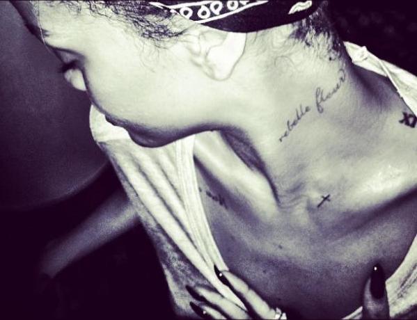 Rihanna has added to her tattoo collection with a slanted cross on her 